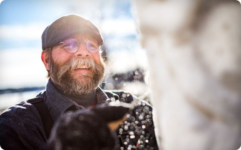 A man carving an ice sculpture. 