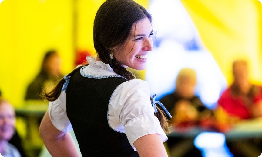 A woman wearing a traditional dirndl during Oktoberfest. 