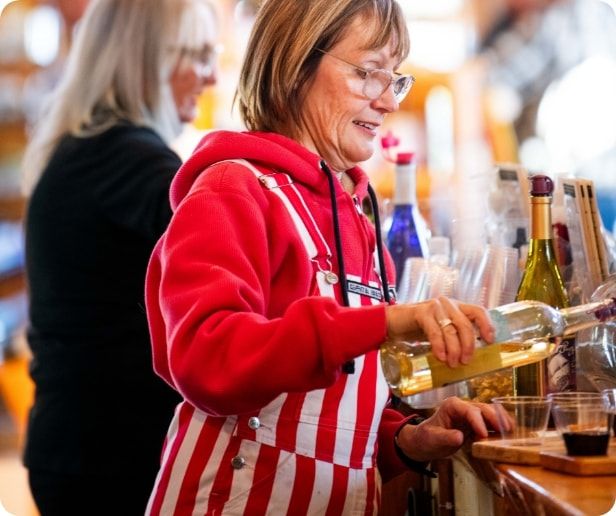 Two ladies sampling wine.  