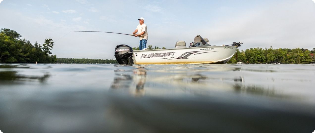 A fisherman casting a line off his boat.  