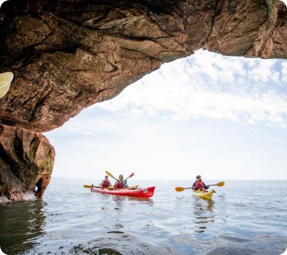 A kayaker paddling near the Apostle Islands.